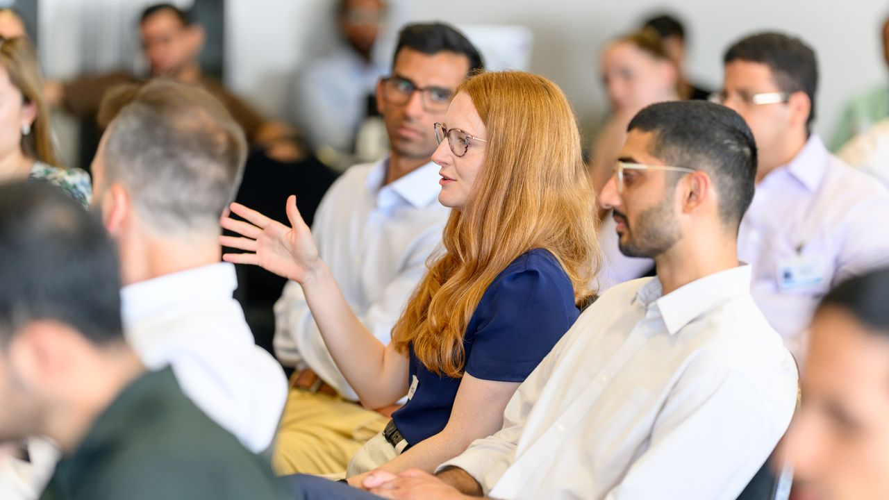 A fellow asking a question during a workshop